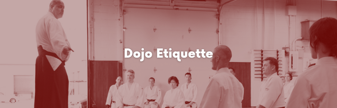 White text that reads “Dojo Etiquette“ overlaid on a photo of people participating in an aikido class. 