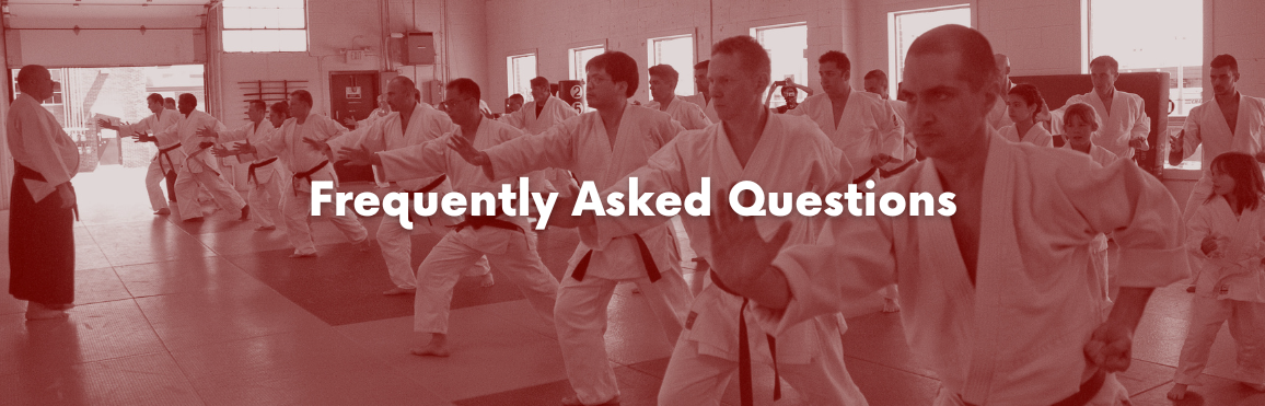 White text that reads “Frequently Asked Questions“ overlaid on a photo of people participating in an aikido class.